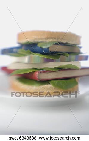 Close-up of note pads between a sandwich on a plate View Large Photo Image Stock Photo - Close-up of note pads between a sandwich on a plate. Fotosearch