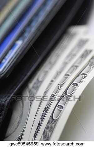Close-up of one hundred dollar bills in a wallet View Large Photo Image Stock Photo - Close-up of one hundred dollar bills in a wallet. Fotosearch