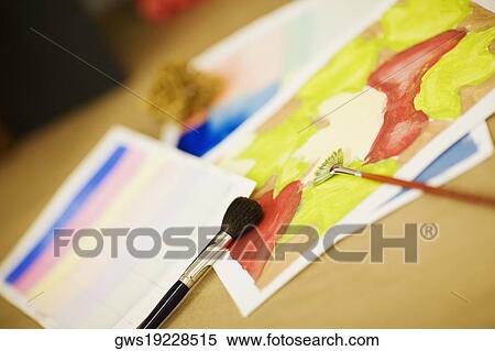 Close-up of paintings with paint brushes View Large Photo Image Stock Photography - Close-up of paintings with paint brushes. Fotosearch