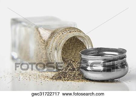 Close-up of pepper powder spilling out of a pepper shaker View Large Photo Image Stock Photo - Close-up of pepper powder spilling out of a pepper shaker. Fotosearch