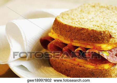 Close-up of roast beef and cheese sandwich on a plate View Large Photo Image Stock Image - Close-up of roast beef and cheese sandwich on a plate. Fotosearch