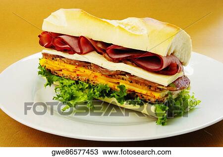 Close-up of roast beef and cheese sandwich on a plate View Large Photo Image Stock Image - Close-up of roast beef and cheese sandwich on a plate. Fotosearch