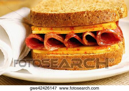 Stock Photo - Close-up of roast beef and cheese sandwich on a plate. Fotosearch