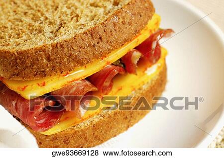 Close-up of roast beef and cheese sandwich on a plate View Large Photo Image Stock Photo - Close-up of roast beef and cheese sandwich on a plate. Fotosearch