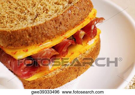Close-up of roast beef and cheese sandwich on a plate View Large Photo Image Stock Photograph - Close-up of roast beef and cheese sandwich on a plate. Fotosearch