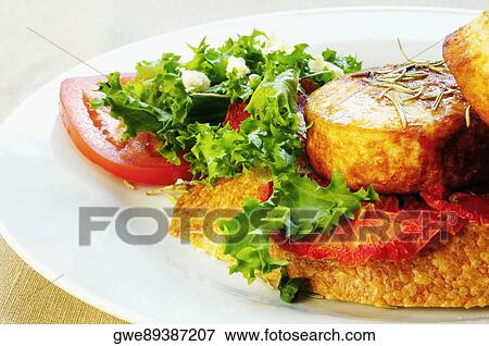 Close-up of roast meat and lettuce on a plate View Large Photo Image Stock Photo - Close-up of roast meat and lettuce on a plate. Fotosearch