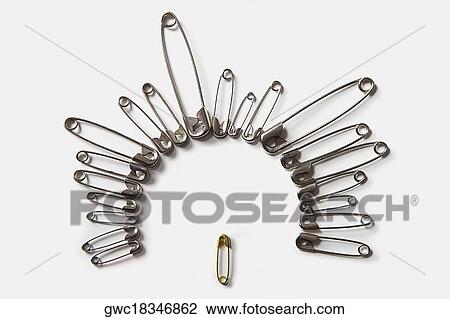 Close-up of safety pins arranged in a circle View Large Photo Image Stock Image - Close-up of safety pins arranged in a circle. Fotosearch