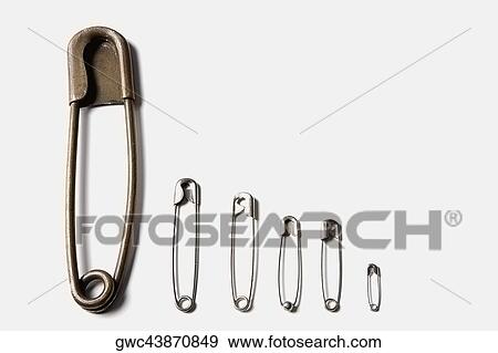 Close-up of safety pins View Large Photo Image Stock Photo - Close-up of safety pins. Fotosearch