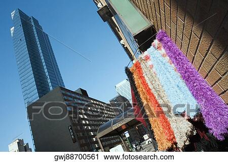 Close-up of scarves hanging on a hanger View Large Photo Image Stock Image - Close-up of scarves hanging on a hanger. Fotosearch