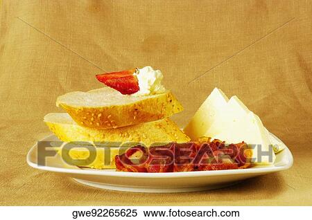 Close-up of slices of bread and cheese on a plate View Large Photo Image Stock Photography - Close-up of slices of bread and cheese on a plate. Fotosearch