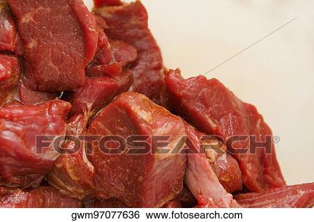 Close-up of slices of raw meat View Large Photo Image Stock Photograph - Close-up of slices of raw meat. Fotosearch