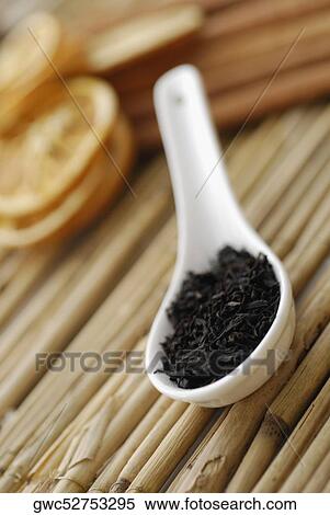 Close-up of tea leaves in a spoon View Large Photo Image Stock Photography - Close-up of tea leaves in a spoon. Fotosearch