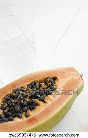 Close-up of the cross section of a papaya View Large Photo Image Stock Photography - Close-up of the cross section of a papaya. Fotosearch