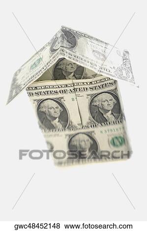 Close-up of the model of a house made of American dollar bills View Large Photo Image Stock Photo - Close-up of the model of a house made of American dollar bills. Fotosearch