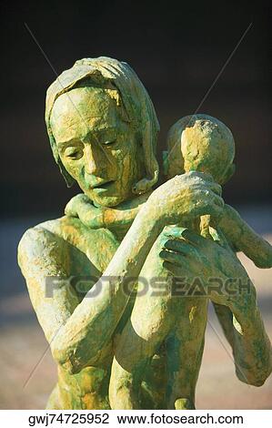 Close-up of the sculpture of a woman with her baby View Large Photo Image Stock Image - Close-up of the sculpture of a woman with her baby. Fotosearch