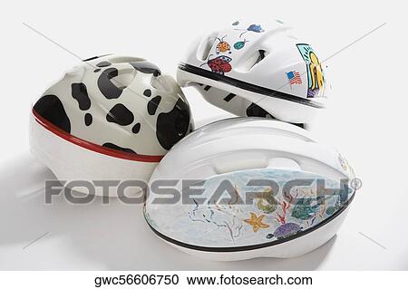 Close-up of three cycling helmets View Large Photo Image Stock Image - Close-up of three cycling helmets. Fotosearch