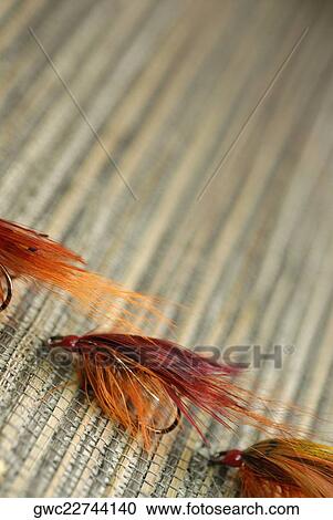 Close-up of three fishing lures View Large Photo Image Stock Image - Close-up of three fishing lures. Fotosearch