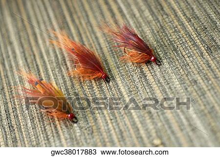Stock Image - Close-up of three fishing lures. Fotosearch