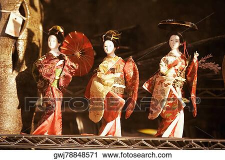 Stock Image - Close-up of three mannequins wearing kimonos. Fotosearch