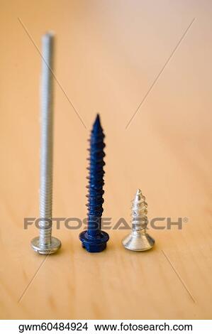 Close-up of three screws in a row View Large Photo Image Picture - Close-up of three screws in a row. Fotosearch