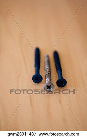 Close-up of three screws View Large Photo Image Stock Photo - Close-up of three screws. Fotosearch
