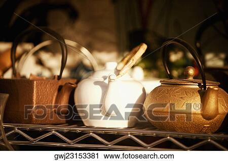 Close-up of three tea kettles View Large Photo Image Stock Image - Close-up of three tea kettles. Fotosearch
