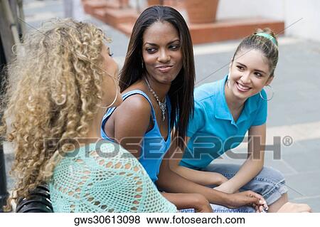 Close-up of three teenage girls smiling View Large Photo Image Stock Photo - Close-up of three teenage girls smiling. Fotosearch