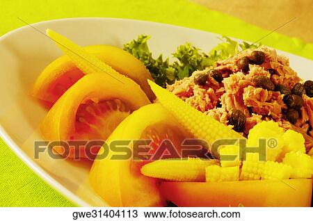 Close-up of tomato slices and baby corn on a plate View Large Photo Image Stock Image - Close-up of tomato slices and baby corn on a plate. Fotosearch