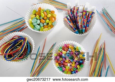 Close-up of toothpicks with multi-colored strings and candy View Large Photo Image Stock Photo - Close-up of toothpicks with multi-colored strings and candy. Fotosearch