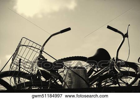 Close-up of two bicycles on a bucket View Large Photo Image Stock Photo - Close-up of two bicycles on a bucket. Fotosearch