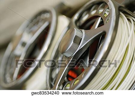 Close-up of two fishing reels View Large Photo Image Stock Image - Close-up of two fishing reels. Fotosearch