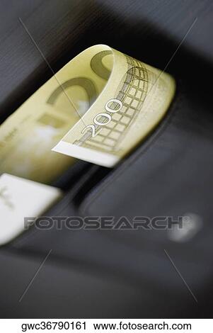 Stock Image - Close-up of two hundred Euro banknote in a wallet. Fotosearch