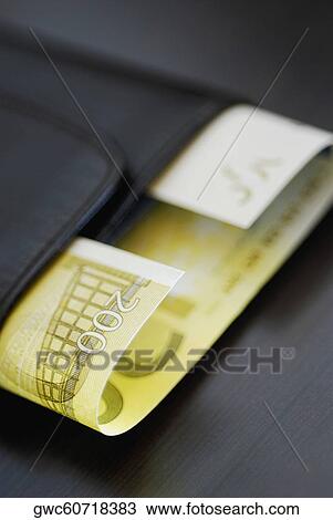 Stock Image - Close-up of two hundred Euro banknote in a wallet. Fotosearch
