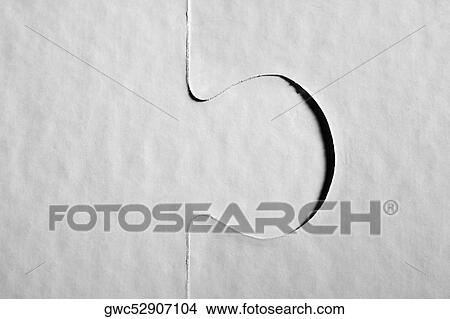 Picture - Close-up of two jigsaw pieces. Fotosearch