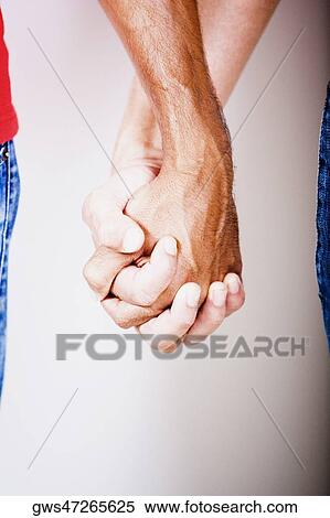 Stock Photography - Close-up of two men's hand. Fotosearch
