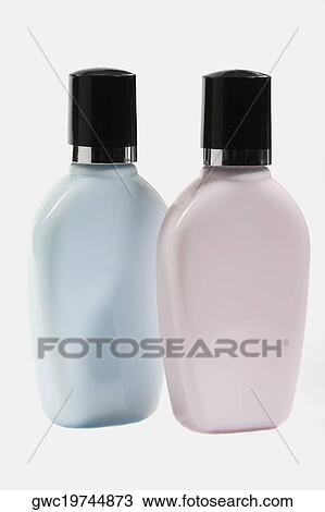Close-up of two moisturizer bottles View Large Photo Image Stock Image - Close-up of two moisturizer bottles. Fotosearch