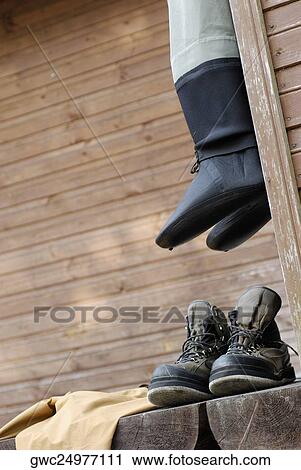 Close-up of two pairs of wading boots View Large Photo Image Stock Image - Close-up of two pairs of wading boots. Fotosearch