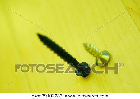 Close-up of two screws View Large Photo Image Stock Image - Close-up of two screws. Fotosearch