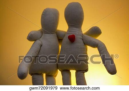 Close-up of two stuffed toys with arms around each other View Large Photo Image Stock Photo - Close-up of two stuffed toys with arms around each other. Fotosearch