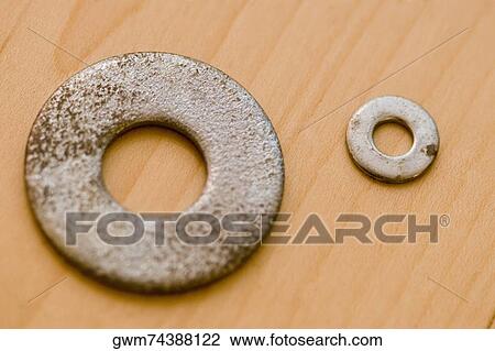 Close-up of two washers View Large Photo Image Stock Image - Close-up of two washers. Fotosearch