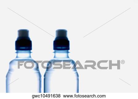 Close-up of two water bottles View Large Photo Image Stock Photo - Close-up of two water bottles. Fotosearch