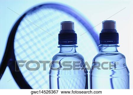 Close-up of two water bottles with a tennis racket View Large Photo Image Stock Photo - Close-up of two water bottles with a tennis racket. Fotosearch