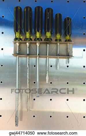 Close-up of various screwdrivers in a rack View Large Photo Image Stock Image - Close-up of various screwdrivers in a rack. Fotosearch