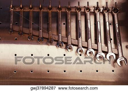 Close-up of various spanners hanging from hooks View Large Photo Image Stock Photo - Close-up of various spanners hanging from hooks. Fotosearch