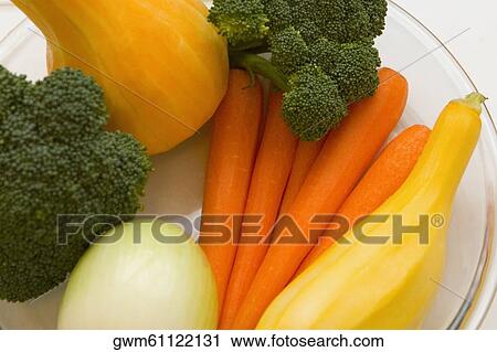 Stock Image - Close-up of vegetables in a plate. Fotosearch