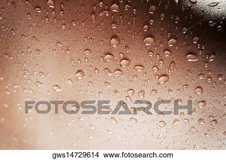 Close-up of water drops on a human body View Large Photo Image Picture - Close-up of water drops on a human body. Fotosearch