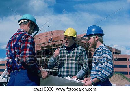 Construction crew looking at blueprints View Large Photo Image Stock Image - Construction crew looking at blueprints . Fotosearch