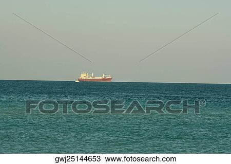 Container ship sailing in the sea View Large Photo Image Stock Image - Container ship sailing in the sea. Fotosearch