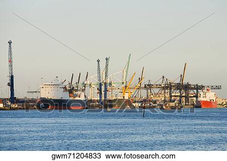 Stock Image - Cranes at a port. Fotosearch