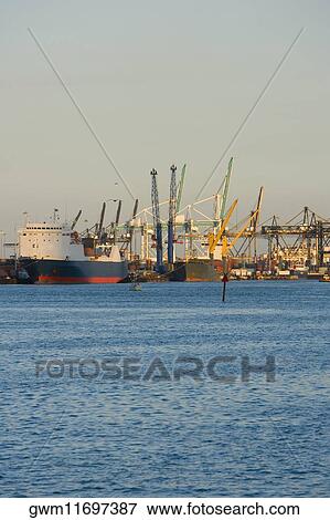 Cranes at a port View Large Photo Image Stock Photo - Cranes at a port. Fotosearch
